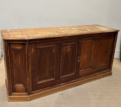 Lot 1033 - A Victorian pine side cabinet with sliding...