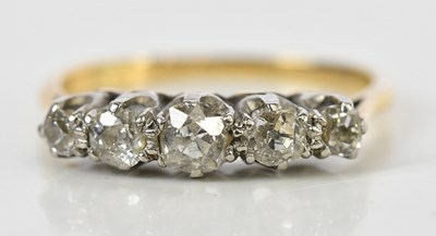 Lot 111 - A yellow metal graduated five stone diamond...