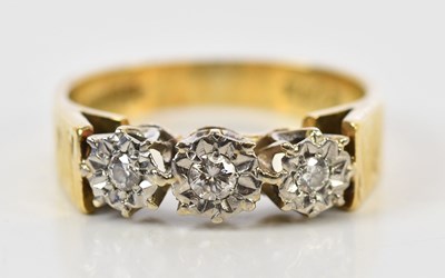 Lot 113 - An 18ct yellow gold three stone illusion set...
