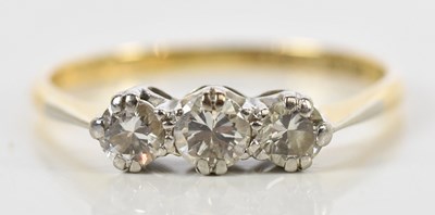 Lot 101 - An 18ct yellow gold platinum tipped three...