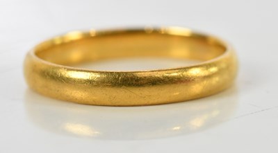 Lot 106 - A 22ct yellow gold wedding band, size Q 1/2,...