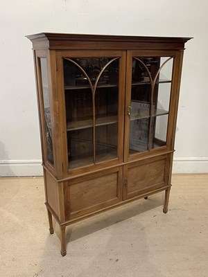 Lot 1274 - An Edwardian inlaid mahogany twin door display...