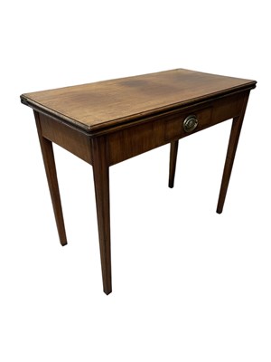 Lot 1273 - A George III mahogany fold-over tea table on...