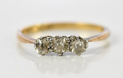 Lot 153 - An 18ct yellow gold three stone diamond ring,...