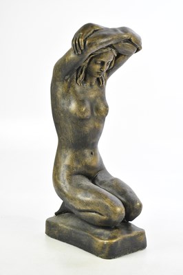 Lot 1556 - A bronzed metal figure of a female nude,...