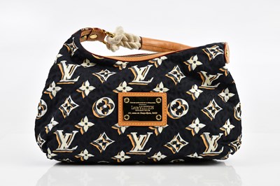 Lot 630 - LOUIS VUITTON; a navy blue Bulles PM nylon...