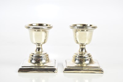 Lot 1031 - A pair of George V hallmarked silver weighted...