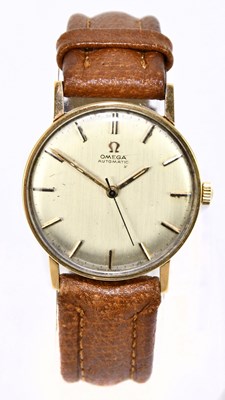 Lot 1690 - OMEGA; a gentleman's vintage automatic yellow...