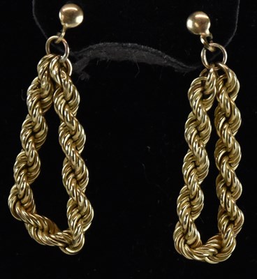 Lot 1257 - A pair of 9ct gold rope twist hoop earrings,...