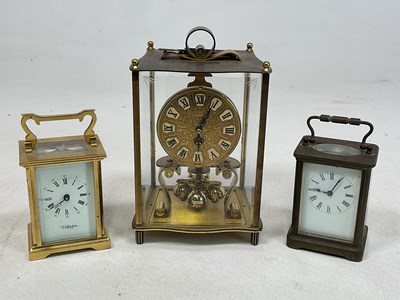 Lot 536 - Three brass carriage clocks, largest height 19cm.