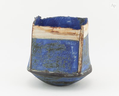 Lot 740 - A square earthenware vessel with stepped rim...