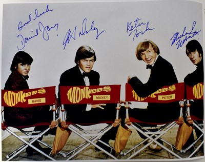 Lot 561 - THE MONKEES; a promotional colour photograph...