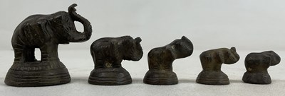 Lot 201 - A set of five graduating bronze opium weights,...