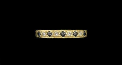 Lot 1264 - An 18ct yellow gold sapphire and diamond half...