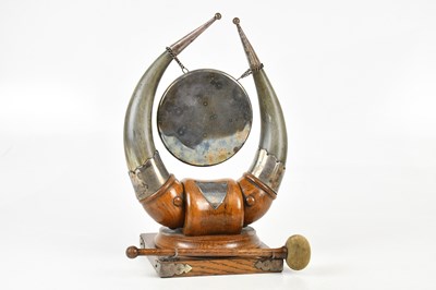 Lot 1334 - A 1920s oak and horn tabletop gong with silver...