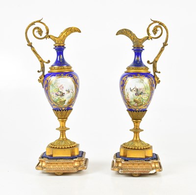 Lot 1329 - A pair of Victorian gilt metal and porcelain...