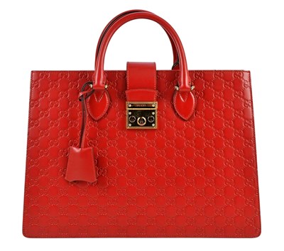 Lot 627 - GUCCI; a red calfskin embossed GG monogram...