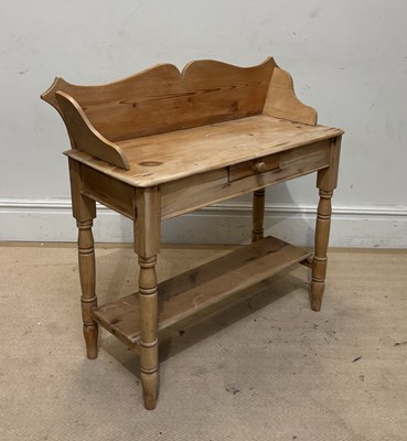 Lot 1053 - An old pine single drawer two tier washstand,...