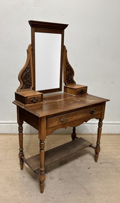 Lot 1276 - An Edwardian walnut mirror back two tier...