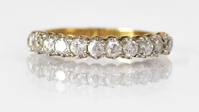 Lot 1038 - A 9ct yellow gold half eternity ring set with...