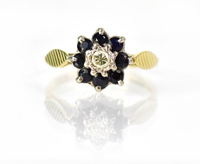 Lot 1030 - An 18ct yellow gold ring set with a central...
