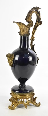 Lot 1554 - A gilt metal and blue ceramic ewer mounted...