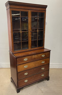 Lot 1109 - A Georgian inlaid mahogany secretaire bookcase,...