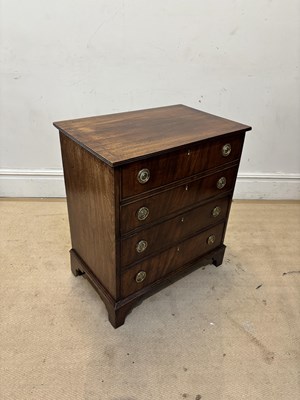 Lot 1263 - A 19th century mahogany commode chest, on...