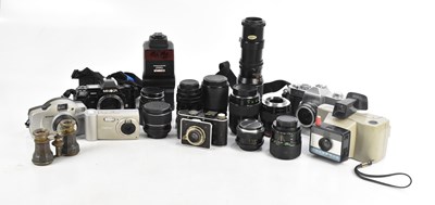 Lot 1585 - An assortment of vintage cameras and lenses...