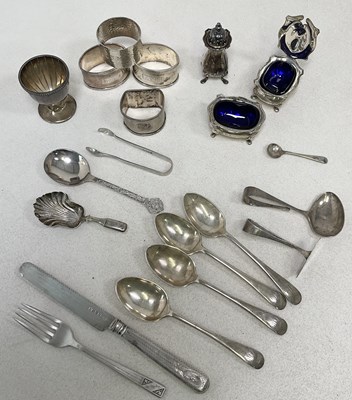 Lot 1027 - A group of small silver comprising four napkin...