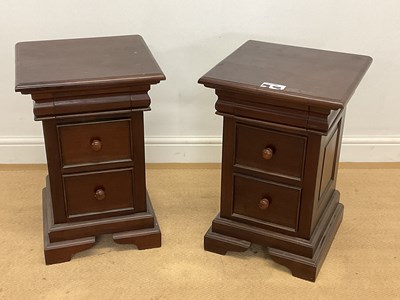 Lot 669 - A pair of dark wood bedside chests, each with...