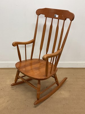 Lot 677 - A reproduction beech rocking chair, height 105cm.