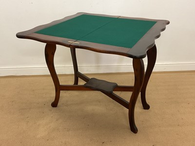 Lot 678 - A reproduction mahogany folding card table...