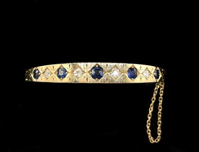 Lot 1127 - An Edwardian yellow metal sapphire and diamond...