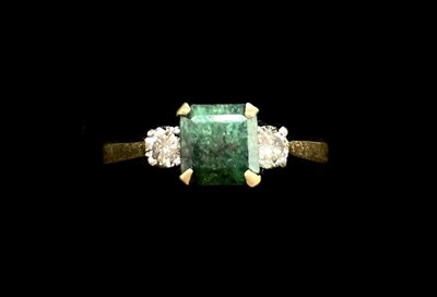 Lot 1135 - An 18ct yellow gold emerald and diamond...