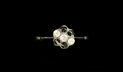 Lot 1193 - An 18ct yellow gold flower head ring (four...