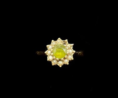 Lot 1199 - A 9ct yellow gold green peridot and seed pearl...