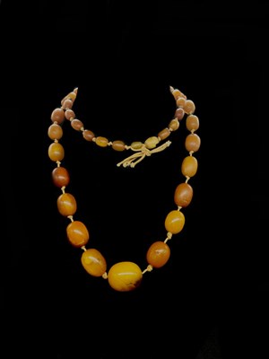 Lot 1201 - A vintage hand tied egg yolk/butterscotch...