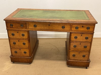 Lot 597 - A knee-hole desk with leather insert, and an...