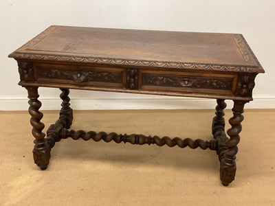 Lot 617 - A carved oak two drawer desk, with two drawers...