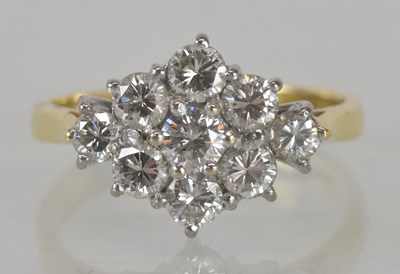 Lot 1107 - An 18ct yellow gold diamond set cluster ring,...