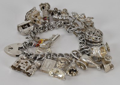 Lot 1313 - A 925 hallmarked silver charm bracelet, with...