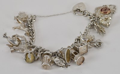 Lot 1314 - A 925 hallmarked silver charm bracelet, with...