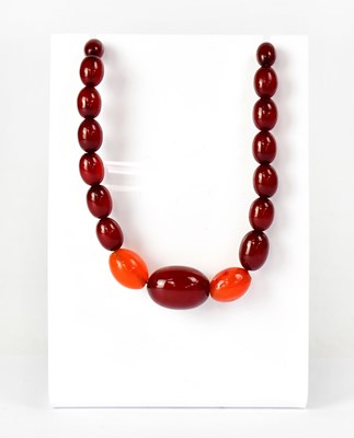 Lot 1088 - A strand of graduated amber-style beads,...
