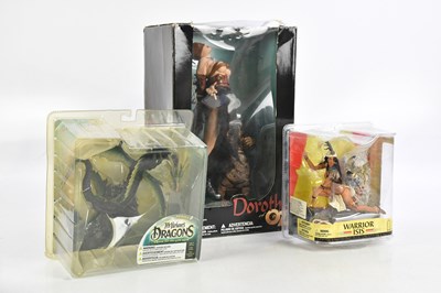Lot 831 - Three boxed action figure by McFarlane Toys,...