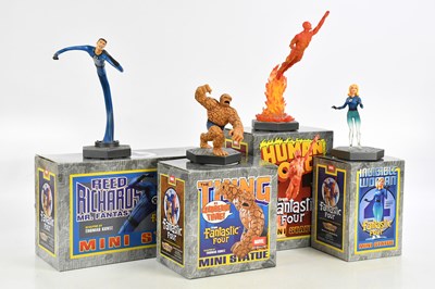 Lot 824 - A collection of four boxed mini statues by...