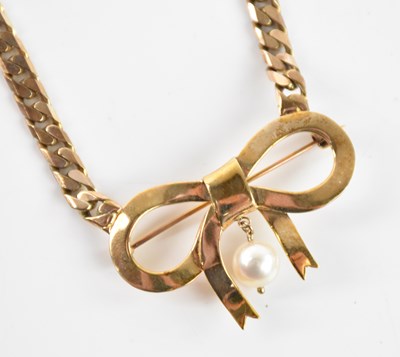 Lot 357 - A 9ct yellow gold curb link chain, suspending...
