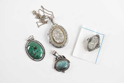 Lot 454 - A silver oval locket on chain, two silver...