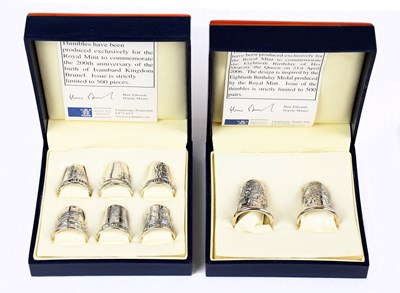 Lot 2411 - ROYAL MINT; two cased sets of hallmarked...