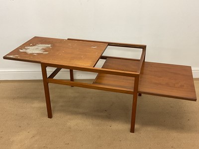 Lot 629 - A mid 20th century teak adjustable coffee/side...